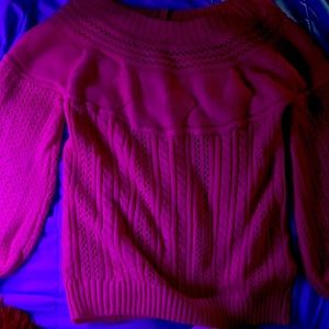 A pink sweater